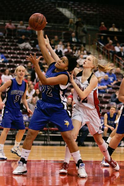 Kendalyn Brainard pulls down a rebound for Coeur d’Alene. Special to  (Steve Conner Special to)
