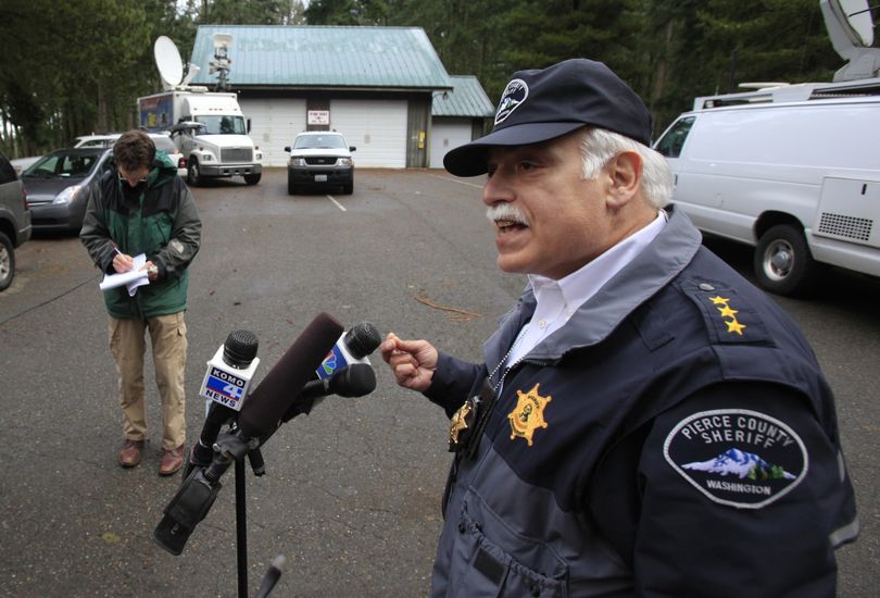 Pierce County Sheriff Paul Pastor gives a briefing, Tuesday, Dec. 22, 2009, near the home where two Pierce County Sheriff's deputies were shot Monday night in rural Pierce County near Eatonville, Wash. (Ted Warren / Associated Press)