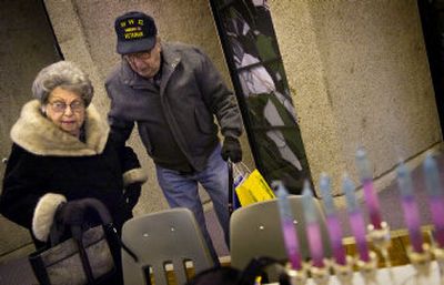 
Gerald Cooper and his wife, Lorraine, attend a senior luncheon at Temple Beth Shalom on Tuesday, thanks to the ride they got from Jewish Family Services, which helps the elderly and less fortunate.
 (Holly Pickett / The Spokesman-Review)