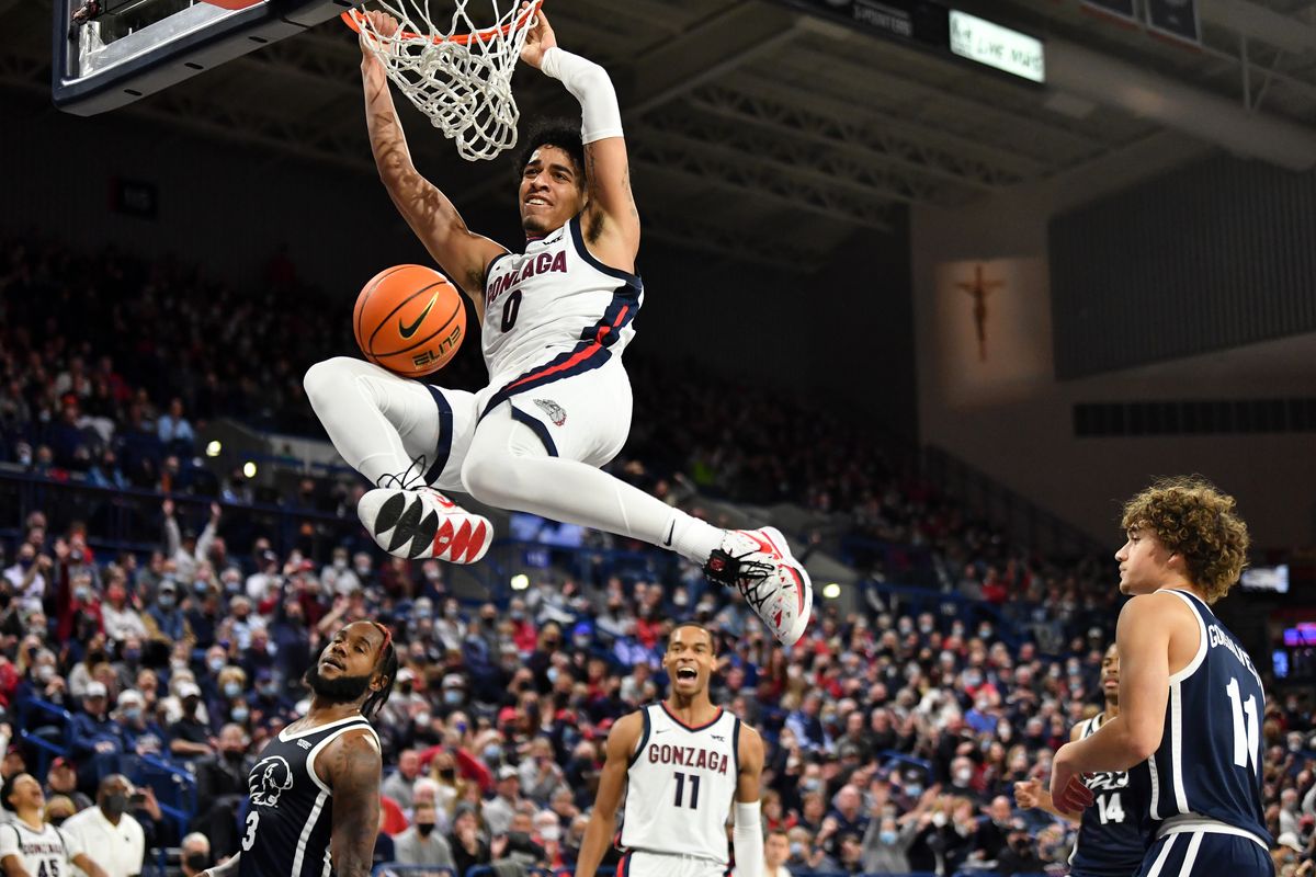 Gonzaga Bulldogs guard Julian Strawther (0) dunks the ball on a play that officials said was a technical foul due to the duration of time Strawther spent hanging from the rim during the second half of a college basketball game on Tuesday, Nov 9, 2021, at McCarthey Athletic Center in Spokane, Wash. Gonzaga won the game 97-63.  (Tyler Tjomsland/The Spokesman-Review)