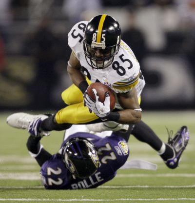 Steelers wide receiver Nate Washington (85) is tackled by cornerback Samari Rolle of the Ravens.  (Associated Press / The Spokesman-Review)