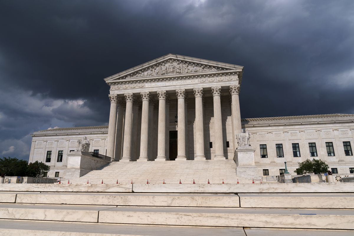 In this June 8, 2021 photo, with dark clouds overhead, the Supreme Court is seen in Washington.  (J. Scott Applewhite)