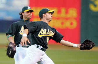 
Marco Scutaro and the Oakland A's have been scrambling to keep up this season after the latest round of off-season moves by general manager Billy Beane. 
 (Associated Press / The Spokesman-Review)