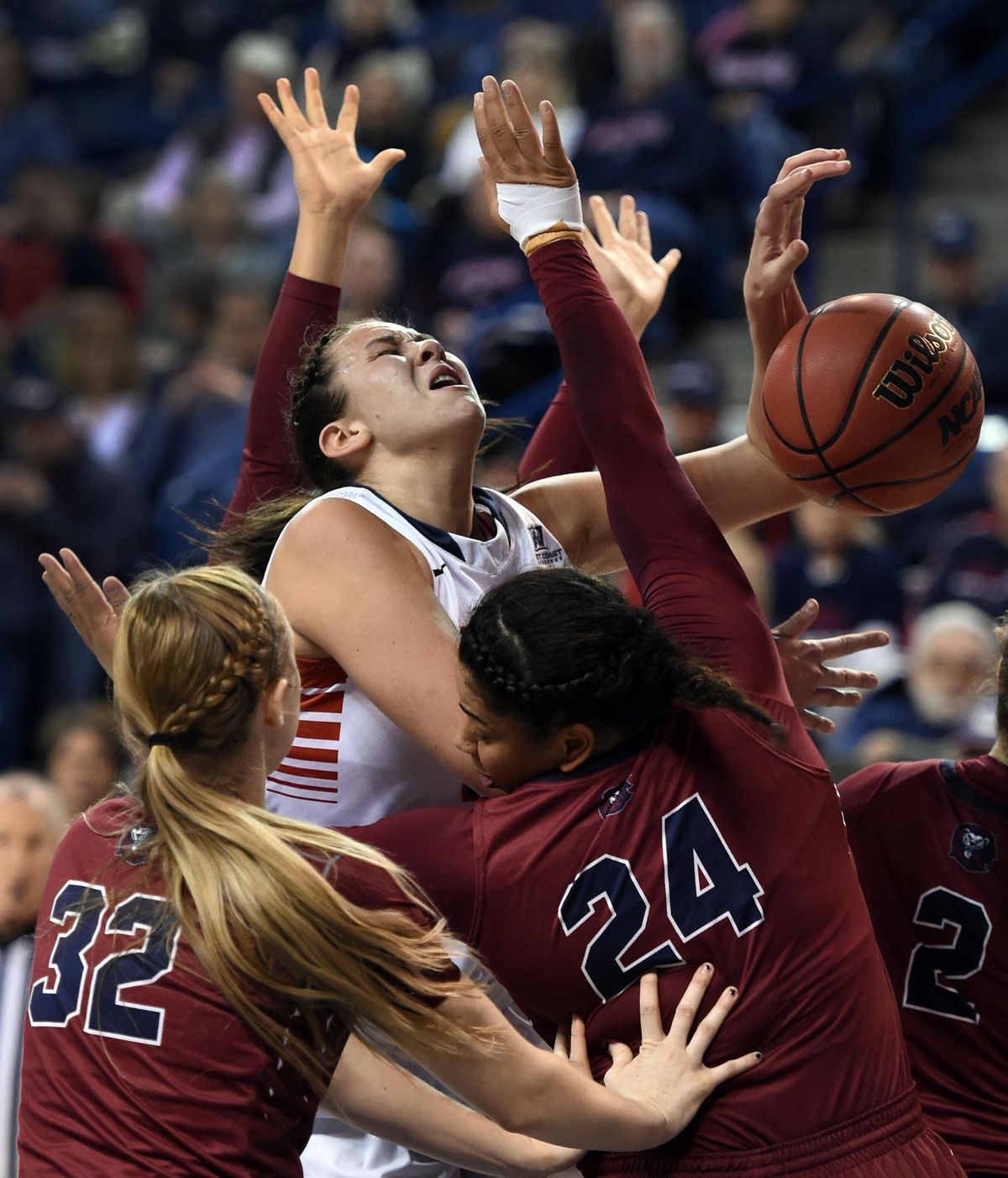 Gonzaga’s Jill Barta is fouled by Loyola Marymount’s Bree Alford (24) during second-half action on Thursday in Spokane. (Colin Mulvany / The Spokesman-Review)