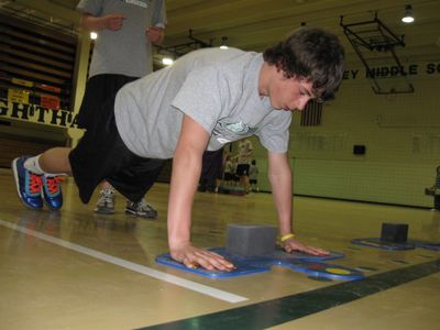 Cheney Middle School student Micah Weller does push-ups during his fitness assessment.  (Lisa Leinberger / The Spokesman-Review)