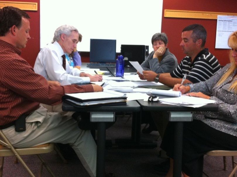 The Spokane County Canvassing Board meets on Wednesday, Sept. 1 to finalize results of the August 2010 primary. Pictured are County Commission Chairman Mark Richard (left); county attorney Jim Emacio, representing County Prosecutor Steve Tucker; County Auditor Vicky Dalton; and Elections Manager Mike McLaughlin. The voting members of the convassing board on Wednesday were Richard, Emacio and McLaughlin. Dalton gave up her seat on the board to McLaughlin because her name appeared on the ballot. (Jonathan Brunt / The Spokesman-Review)