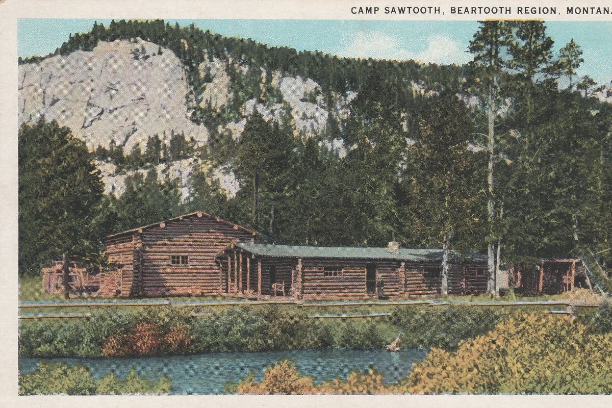 This undated, hand-tinted photo shows Camp Sawtooth. Although the buildings were burned down, evidence of the old dude ranch remains in Wyoming