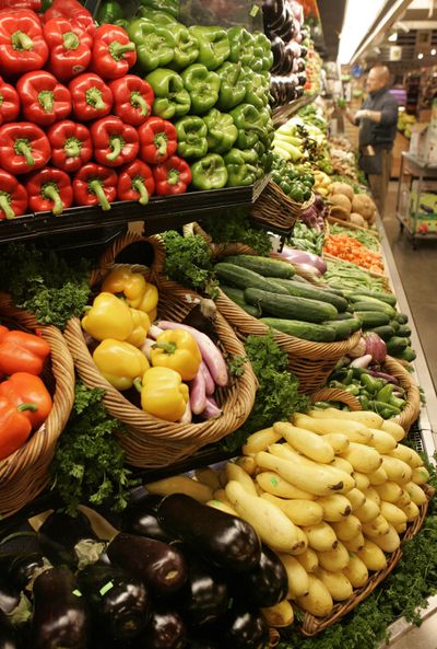 Bell peppers, squash and eggplants await produce buyers at a Whole Foods Market in New York City’s Union Square district. (Associated Press)