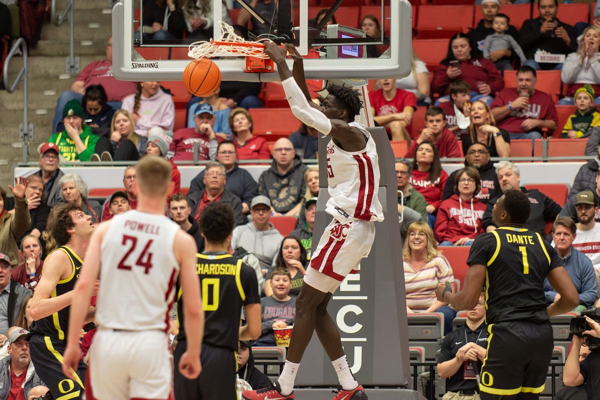 Washington State forward Mouhamed Gueye dunks the ball against Oregon in the second half on Sunday at Beasley Coliseum in Pullman. Washington State won the game 68-65.  (Geoff Crimmins)