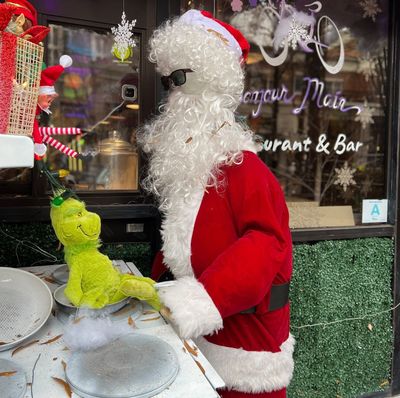 The stuffed Santa decoration that was stolen from the display outside a restaurant in Greenville, South Carolina, on Dec. 14. The day after he took it, the thief returned the Santa and apologized.  (Bonjour Main/Bonjour Main)