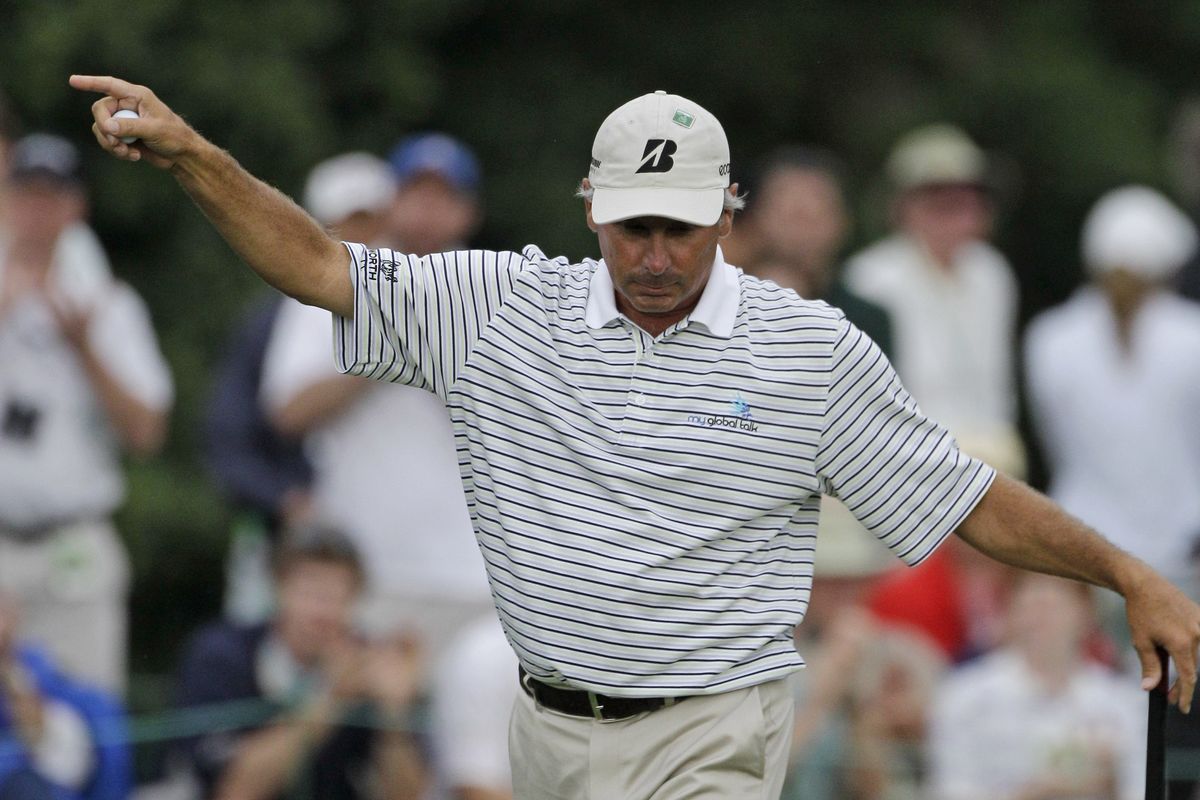 First-round leader Fred Couples reacts to his birdie putt on the 17th hole.  (Associated Press)