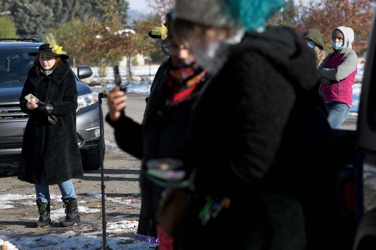 Emily Peters, left, spokesperson for Human Rights Activist Coterie, gathers with protesters Tuesday in front of Spokane County Sheriff’s Training Center in opposition to “warrior style” police training in Newman Lake.  (Kathy Plonka/The Spokesman-Review)