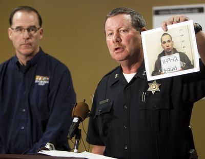 Boise police Chief Michael Masterson, right, with Zoo Boise Director Steve Burns, announces the arrest Monday of Michael J. Watkins, 22, of Weiser, Idaho, who investigators suspect killed a patas monkey at Zoo Boise after breaking into the zoo early Saturday. (Associated Press)