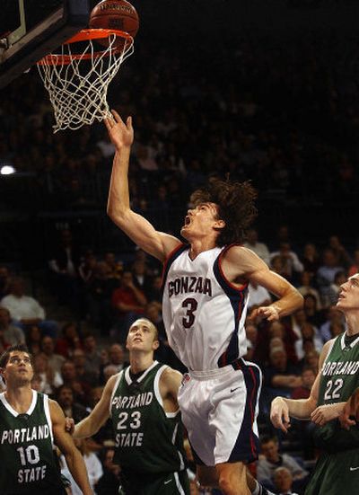 Gonzaga forward Adam Morrison cuts between three Portland State players on the way to two of his 34 points Wednesday night. 
 (Brian Plonka / The Spokesman-Review)