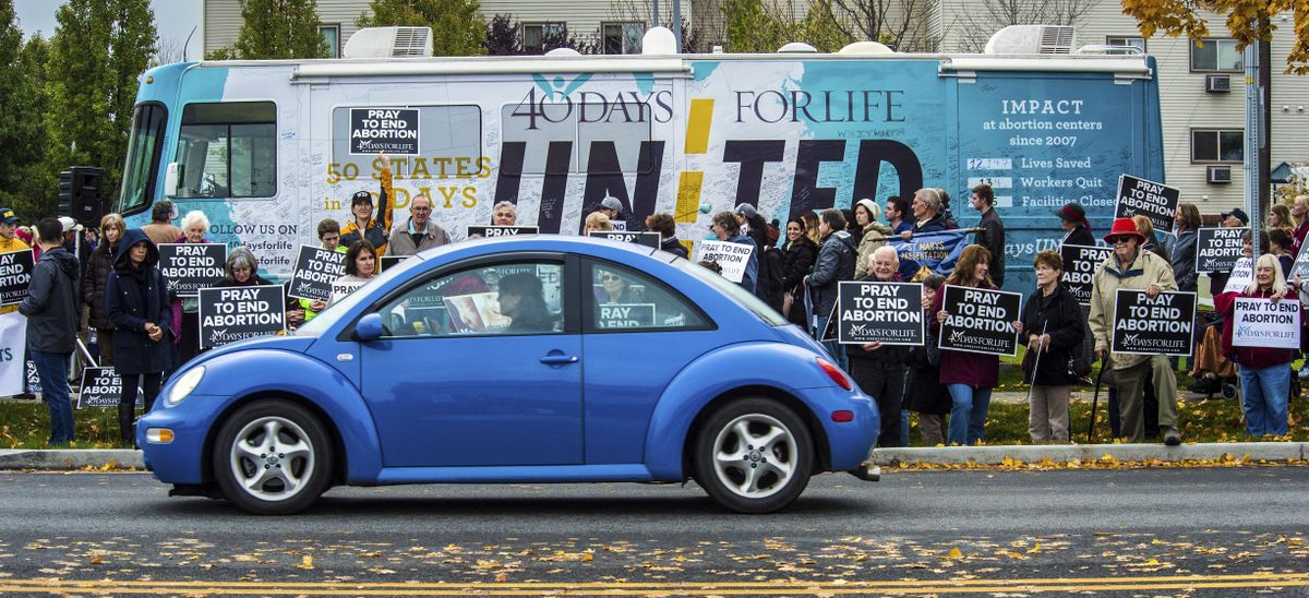 Over 100 people gathered on the Salvation Army’s property to participate in the “40 Days for Life” rally, Oct. 21, 2016, in Spokane, Wash. The bus and organizers are traveling across America, visiting 125 cities to promote prayer and fasting. (Dan Pelle / The Spokesman-Review)