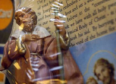 Kaufer Co. Christian Supplies has nearly sold out of St. Joseph home-selling kits, which include a statue of St. Joseph and a prayer. (Holly Pickett / The Spokesman-Review)