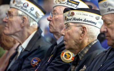 
Pearl Harbor survivor Bob Ohnemus, second from right, of Cheney sits among friends and fellow survivors, from left, Joseph Wagner of Spokane, Ray Daves of Deer Park and Bill Paulakonis of Spokane during a Veterans Day ceremony Friday at Spokane Veterans Memorial Arena.
 (Photos by Holly Pickett/ / The Spokesman-Review)