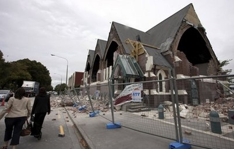 People walk past a church in Christchurch, New Zealand, which was destroyed after an earthquake struck Tuesday, Feb. 22, 2011. The 6.3-magnitude quake collapsed buildings and is sending rescuers scrambling to help trapped people amid reports of multiple deaths.
(AP Photo/NZPA, Pam Johnson) NEW ZEALAND  (Pam Johnson / Nzpa)