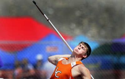 
Lewis and Clark javelin thrower Joe Zimmerman shows the effort of his third place throw at the WIAA State Championship meet in Pasco on Saturday. Zimmerman threw the javelin 199 feet 6 inches. 
 (CHRISTOPHER ANDERSON / The Spokesman-Review)