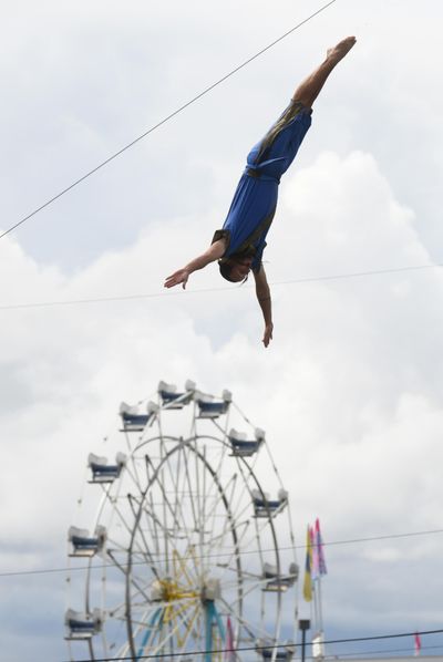 Jeff Matter, a diver from Fairbanks, Alaska, drops off a high dive into special pool set up for the Sinbad the Pirate High Dive show at the Monday, Sept. 9, 2019 at the Spokane Interstate Fair. The show features veteran competitive divers performing serious and comical dive routines, including one from an 80-foot platform, and happens at 2, 5 and 8:30 p.m. each day through Saturday, and 2 and 5 p.m. Sunday, the last day of the fair. Jesse Tinsley/THE SPOKESMAN-REVIEW (Jesse Tinsley / The Spokesman-Review)