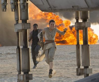 Daisy Ridley, right, as Rey, and John Boyega as Finn, are shown in a scene from the film, 