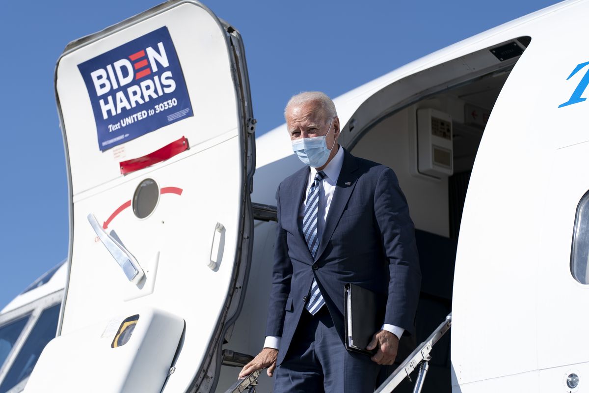 FILE - In this Oct. 6, 2020, file photo Democratic presidential candidate former Vice President Joe Biden arrives at Hagerstown Regional Airport in Hagerstown, Md., to travel to Gettysburg, Pa. Biden and his running mate, California Sen. Kamala Harris, were scheduled to visit the Phoenix area on Thursday, Oct. 8, campaigning together for the first time since the Democratic convention.  (Andrew Harnik)