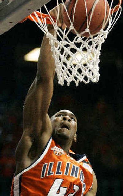 
Illinois' Roger Powell slam dunks against Wisconsin-MIlwaukee in the first half of their semifinal matchup. 
 (Associated Press / The Spokesman-Review)