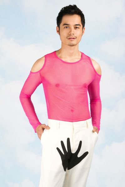 This undated publicity photo provided by courtesy of Opening Ceremony shows a pink mesh Cutout Shirt ($145) and white wool with contrast colored black hand Hand Trouser ($335) from Yoko Ono's new menswear collection. (Opening Ceremony)