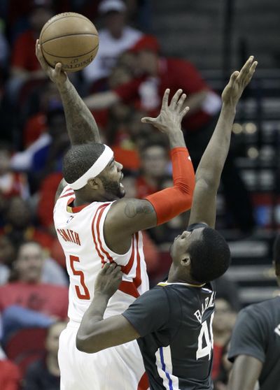 Both the Rockets and Pistons have prospered since Josh Smith, left, changed teams. (Associated Press)
