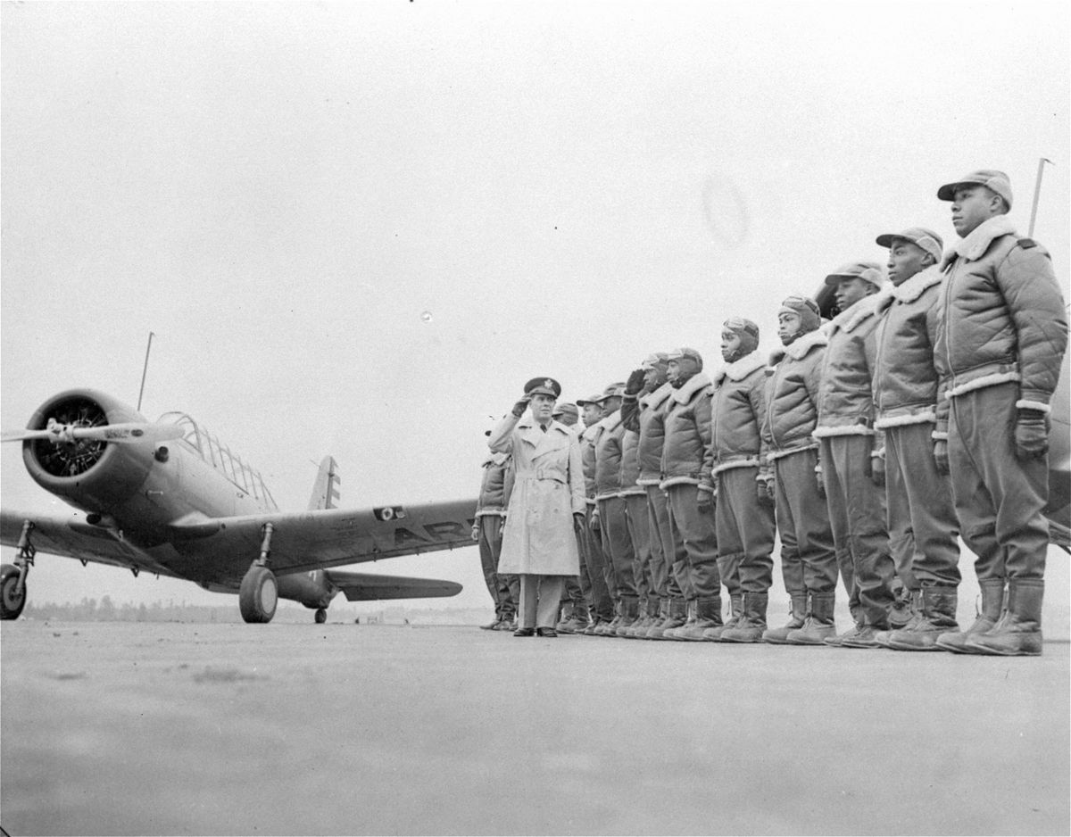 Major James A. Ellison, left, returns the salute of Mac Ross of Dayton, Ohio, as he inspects the cadets at the Basic and Advanced Flying School for Negro Air Corps Cadets in this Jan. 23, 1942, file photo at the Tuskegee Institute in Tuskegee, Ala.  (U.S. Army Signal Corps)