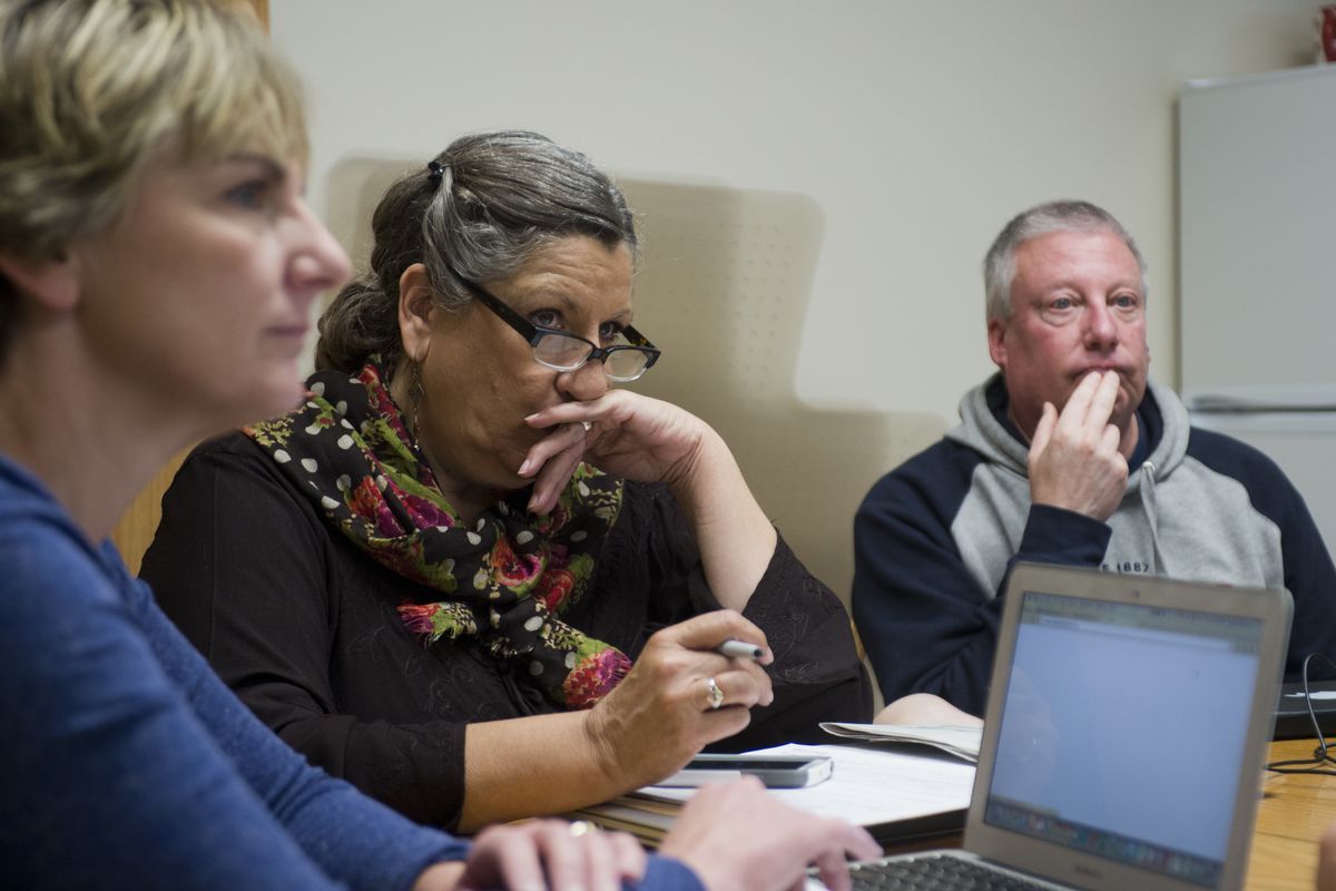 From left, Becky Dickerson, Penny Simonson and Tim Steele listen Tuesday to insurance broker Richard Denenny talk about their options under the Affordable Care Act. (Jesse Tinsley)