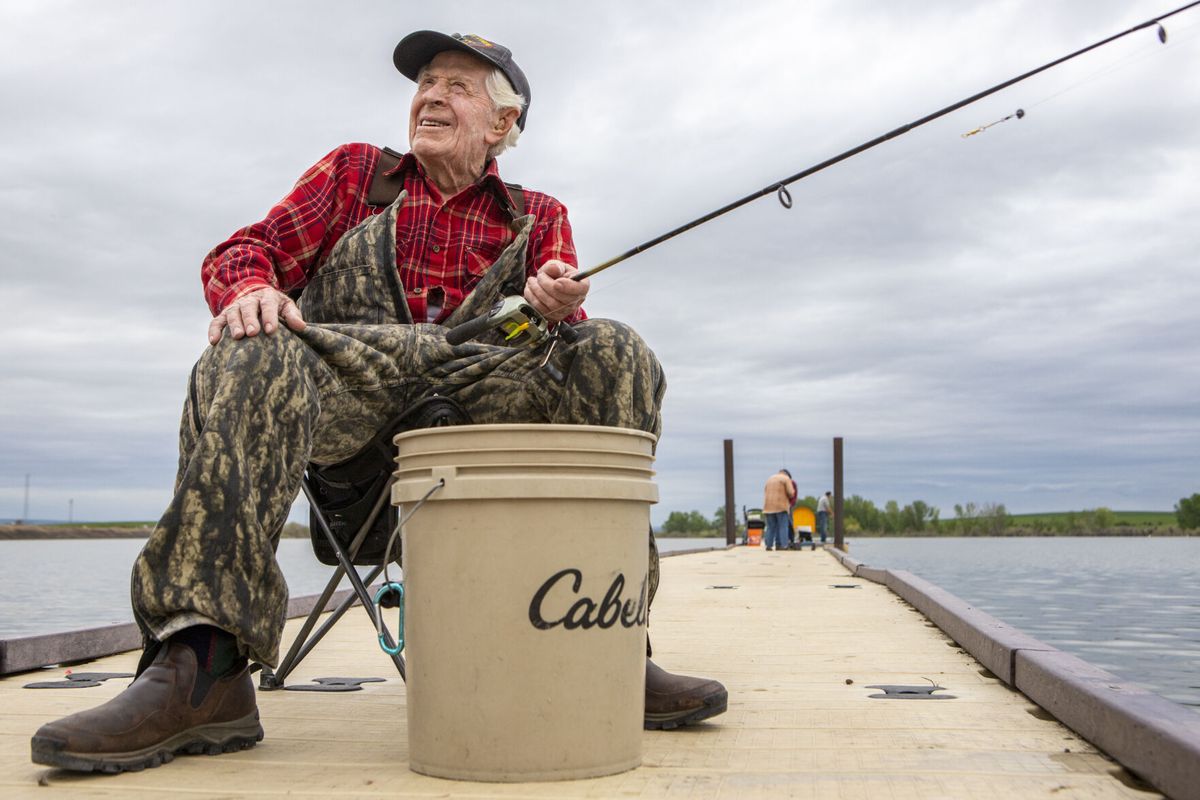 Paul Sauder enjoys some morning fishing May 25 at Mann Lake in the Lewiston Orchards. Sauder, who is 98, fishes off this dock a few times a week.  (Austin Johnson/Lewiston Tribune)