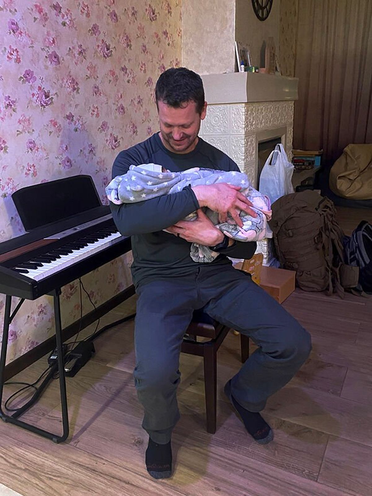 Jared Malone holds a 2-month-old girl who had just escaped from Mariupol, Ukraine, on March 29. Malone nicknamed the girl the “Princess of Mariupol” and said she “saved me that night; I was struggling.”  (Courtesy of Jared Malone)
