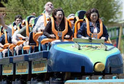 
Reporter Rebecca Santana, front left, rides Six Flags Great Adventure's new roller coaster, Kingda Ka, in Jackson, N.J., last month. Six Flags officials say that, on a clear day, brave riders who open their eyes at the summit can see the buildings of downtown Manhattan, 84 miles to the northeast.
 (Associated Press / The Spokesman-Review)