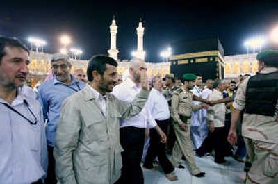 
Iranian President Mahmoud Ahmadinejad waves to pilgrims as he circles the Kaaba, Islam's holiest site, during the hajj pilgrimage in Mecca, Saudi Arabia, last week.Associated Press
 (Associated Press / The Spokesman-Review)