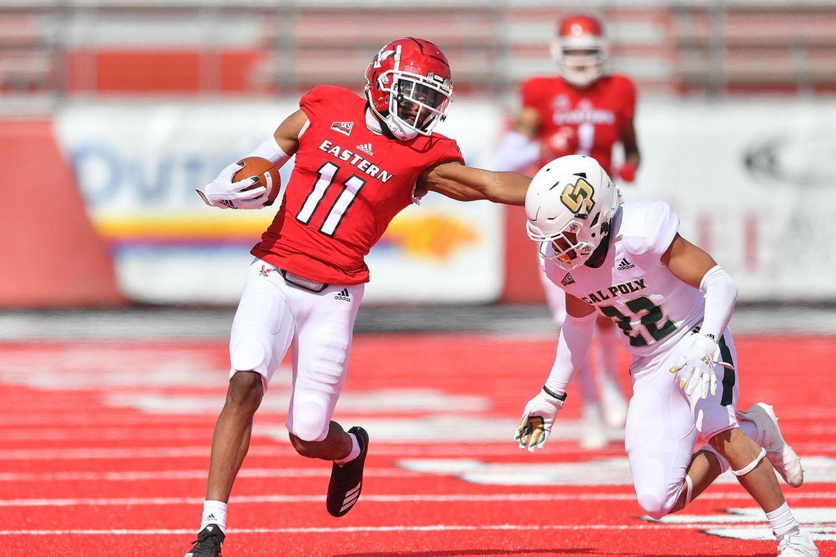 Eastern Washington wide receiver Freddie Roberson attempts to elude the tackle of Cal Poly defensive back Xavier Oliphant on Saturday at Roos Field in Cheney.  (Tyler Tjomsland/The Spokesman-Review)