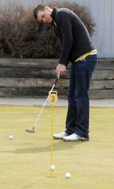 
U-Hi's Hank Frame lines up a putt at MeadowWood Golf Course before a practice round March 25. The junior was the best golfer in the GSL last year.
 (J. BART RAYNIAK / The Spokesman-Review)