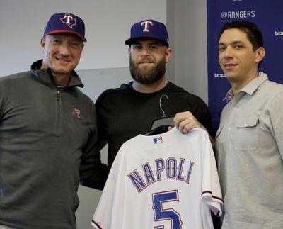 Mike Napoli, center, poses with Texas Rangers manager Jeff Banister, left, and general manager Jon Daniels during a news conference Thursday, Feb. 16, 2017, in Surprise, Ariz. The Rangers announced that the club has signed free agent Napoli to a one-year contract. (Charlie Riedel / Associated Press)