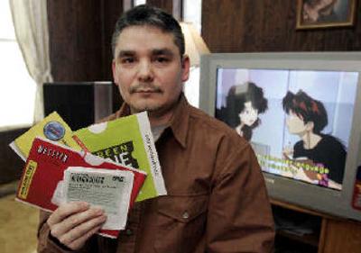 
Manuel Villanueva, of Warren, Mich., realizes he has been getting a pretty good deal since he signed up for Netflix Inc.'s online DVD rental service two years ago, but he still feels shortchanged. 
 (Associated Press / The Spokesman-Review)