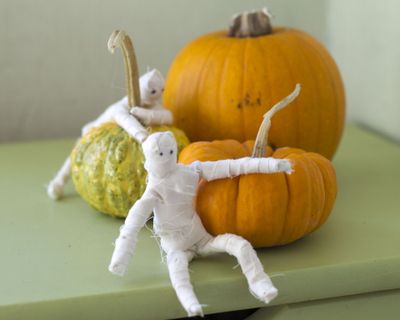 These miniature mummies have flexible pipe cleaner frames that can be positioned in a variety of poses. (Associated Press)