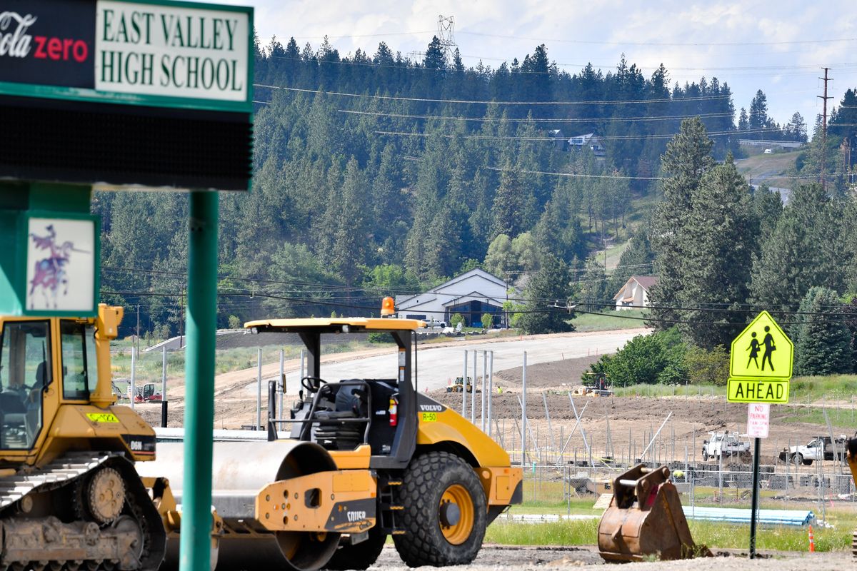 Construction at Bigelow Gulch is seen from East Valley High School on Friday in Spokane Valley.  (Tyler Tjomsland/The Spokesman-Review)