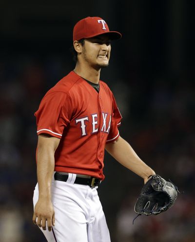 Rangers’ Yu Darvish was the beneficiary of an unusual ruling by an official scorekeeper. (Associated Press)