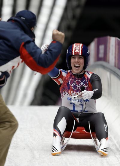 Erin Hamlin of the United States greets her coach after finishing her final run to win the bronze medal during the women's singles luge competition at the 2014 Winter Olympics on Tuesday  in Krasnaya Polyana, Russia.  (Associated Press)