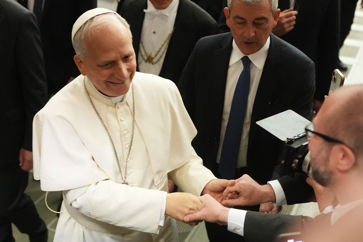 Pope Leo XIV arrives for an audience with thousands of journalists and media workers on Monday at Paul VI Hall in Vatican City, Vatican. The audience with journalists has become a tradition among newly elected popes. (Christopher Furlong)