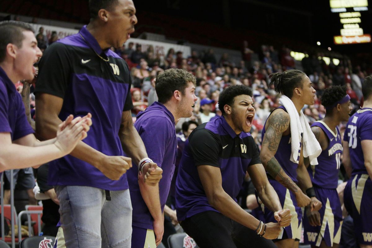The Washington bench celebrates during the second half  Saturday against Washington State in Pullman. (Young Kwak / AP)