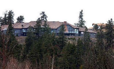 
This home  on Eighth Avenue overlooking Liberty Lake is valued at more than $2 million.  To the west, homes are being built at Legacy Ridge. Both sites are outside  city limits. 
 (Liz Kishimoto / The Spokesman-Review)