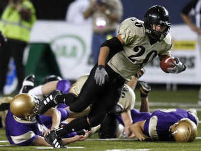 
Royal running back Hector Ledezma runs out of a crowd of Connell defenders during the second quarter of the 1A title game.Associated Press
 (Associated Press / The Spokesman-Review)