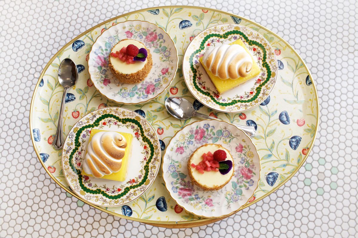 Desserts on flowery china plates and a vintage platter at Elle in Washington, D.C. (Deb Lindsey / The Washington Post)