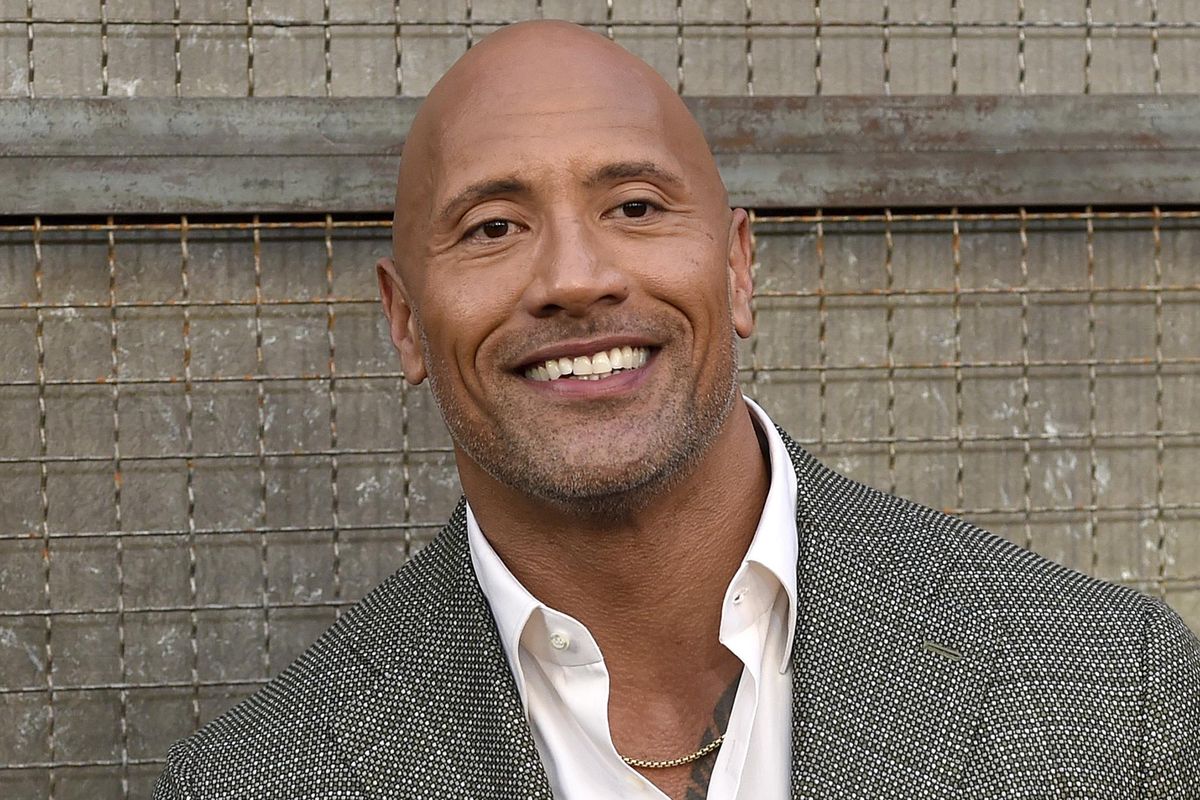 In this April 4, 2018, file photo, Dwayne Johnson arrives at the world premiere of “Rampage” at the Microsoft Theater in Los Angeles. Johnson, who plays an amputee in the action movie “Skyscraper” said Thursday, July 12, he is joining the Boston-based Ruderman Family Foundation, calling for more inclusion and opportunities for people with disabilities in the entertainment industry. (Chris Pizzello / Invision)