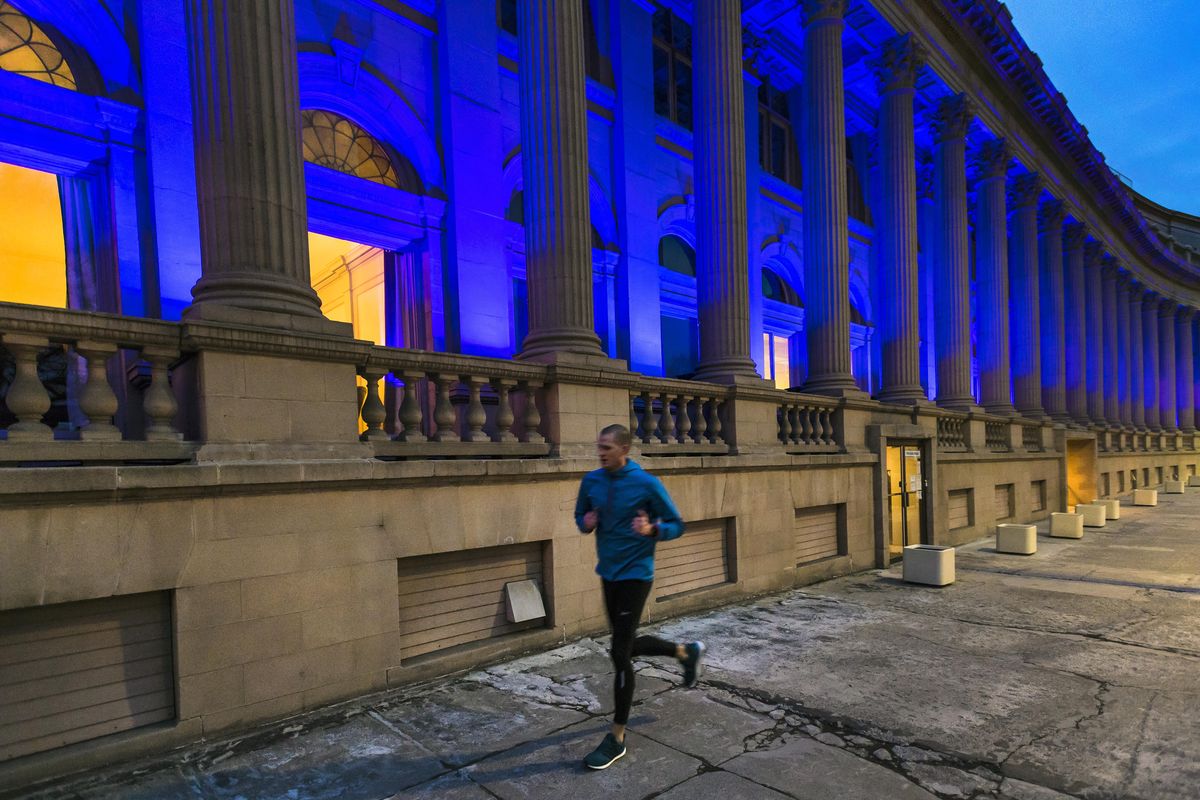 Riverside Place, formally The Masonic Temple, is bathed in blue light, which accentuates its Neo-Classical Revival architecture. (Colin Mulvany / The Spokesman-Review)
